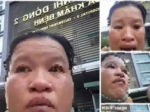 Người phụ nữ ôm con khóc cầu cứu trước bệnh viện yêu cầu dừng chuyển tiền hỗ trợ
